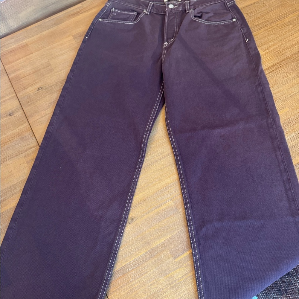 Maroon Etica Straight-Leg Jeans with stitching.